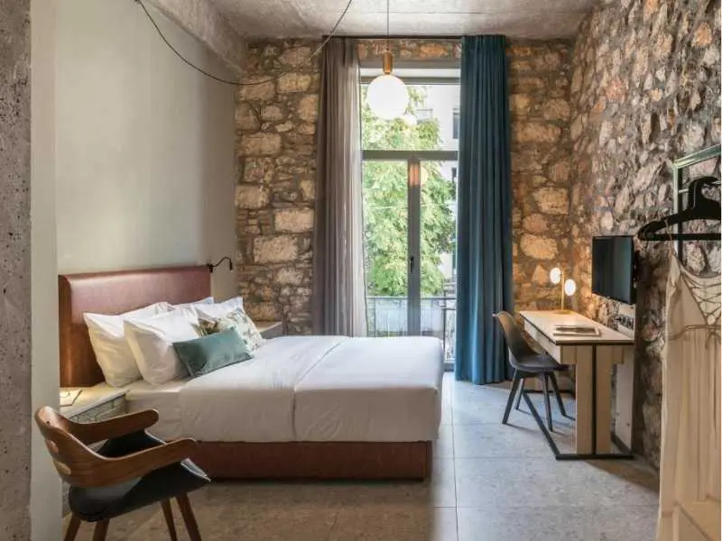 Cohort Koukaki, Bedroom with exposed Stone walls