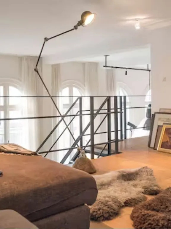 Loft apartment in canal district, Living room with view over mezzanine