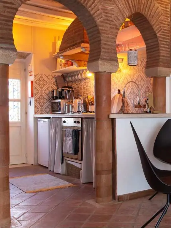 Kitchen with Arched Brick walls 