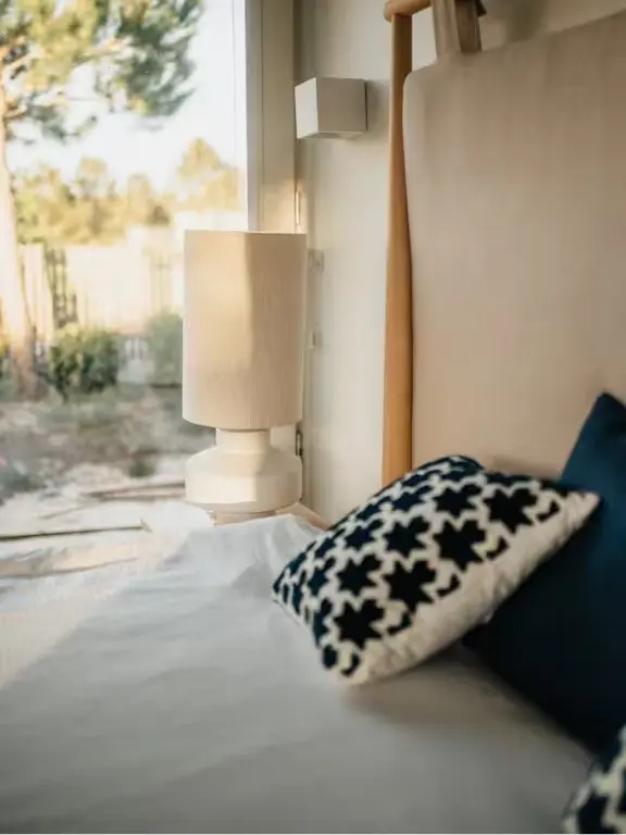 Built-in daybed with neutral cushions and views into the landscape