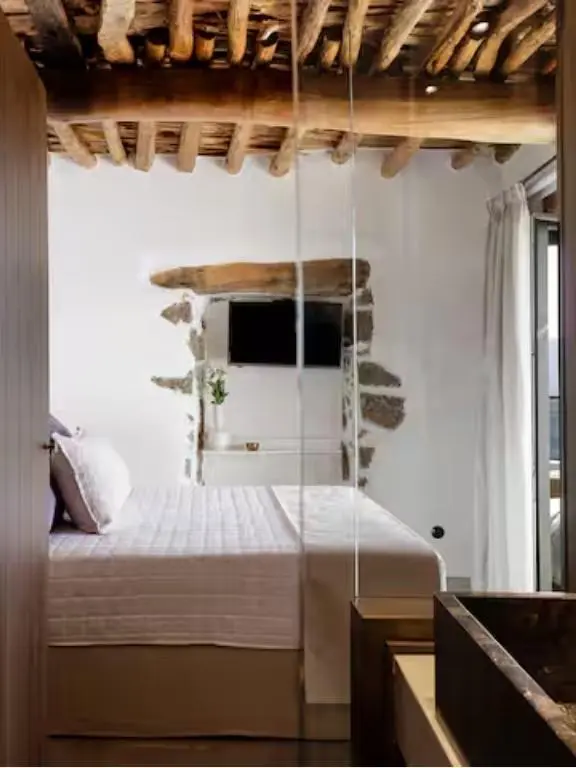 Fedra Suites rustic bedroom interior