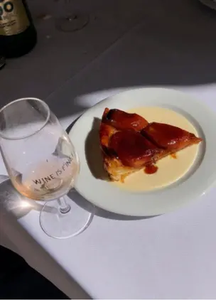 Glass of natural wine and small plates at Wine Is Fine, a popular Athens wine bar