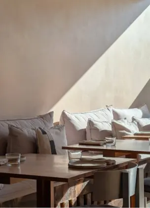 Interior of Restaurant with Sunlight on Walls 