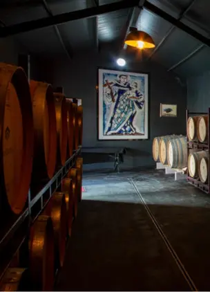 Wine cellar interior lined with barrels and dim ambient lighting