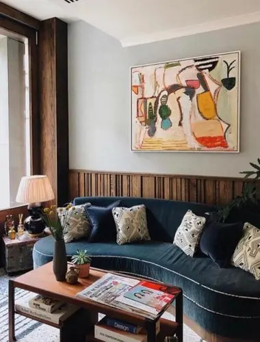 Lounge at Redchurch Townhouse London with blue velvet sofa and bold artwork