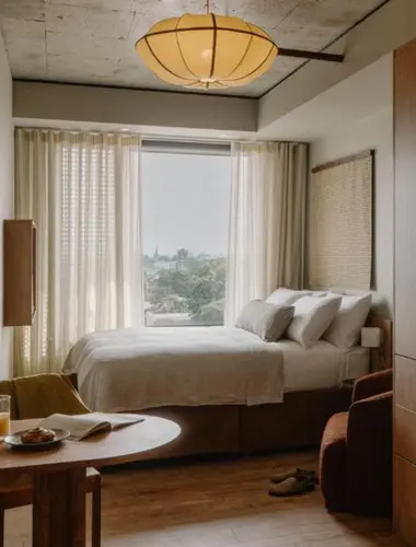 Guest room at Mason and Fifth Westbourne Park London with large window and pendant light