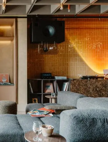 Listening lounge at Mason and Fifth London with yellow tiled wall and vinyl collection
