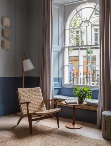 Guest room at Inhabit Southwick Street hotel Paddington with arched window