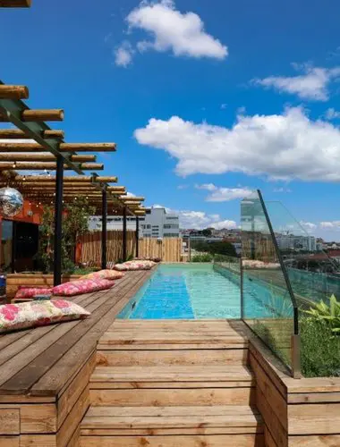 Rooftop pool at JAM Hotel Lisbon Santos with timber decking and Tagus views Hotels in Santos Lisbon