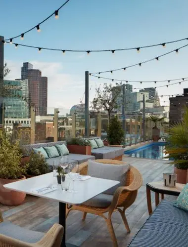 Rooftop terrace at Virgin Hotels London Shoreditch with city views