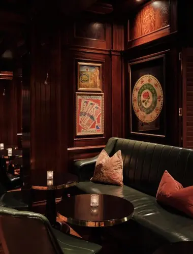 Bloomsbury Club Bar at The Bloomsbury Hotel London with dark wood panelling