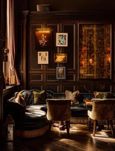 Fitz's Bar at Kimpton Fitzroy London with velvet sofas and dark wood panelling
