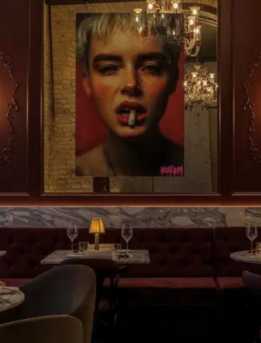 Moody dining space with contemporary artwork at Chapter Roma, one of the coolest hotels in Rome