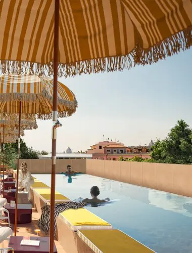 Rooftop pool at Experimental Roma with panoramic views across the Rome skyline