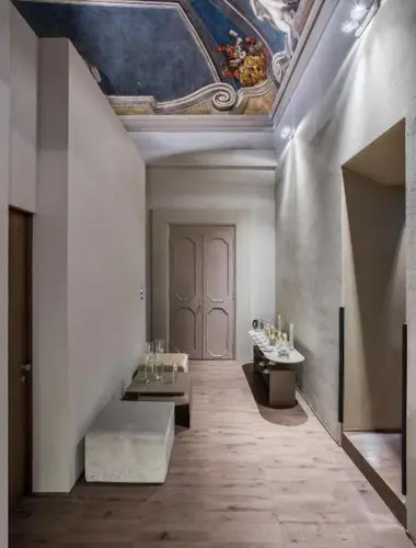 Elegant hallway beneath original frescoed ceilings at Hotel Dei Barbieri, a historic hotel in Centro Storico Rome