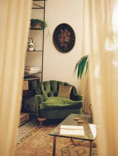 Elegant sitting room at Shila, one of the best hotels in Kolonaki Athens, featuring vintage furnishings and curated design