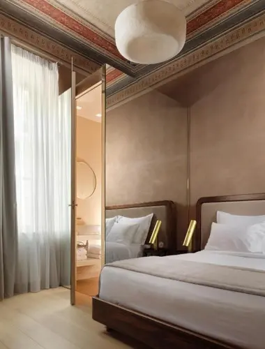 Elegant guest room at Monument Hotel, a restored heritage hotel in Monastiraki Athens