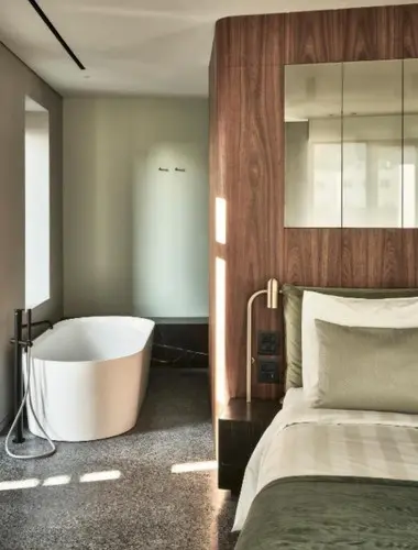 Contemporary guest room with freestanding bath at Perianth Hotel, a stylish hotel in Monastiraki Athens