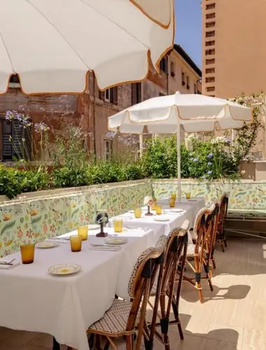 Sunny terrace restaurant at Casa Monti, a design-led hotel in Rome’s creative Monti neighbourhood