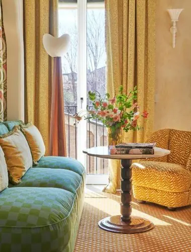 Vibrant guest room at Casa Monti blending contemporary style with classic Roman character