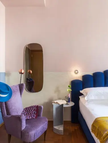 Colourful contemporary guest room at Condominio Monti, a stylish boutique hotel in Monti Rome