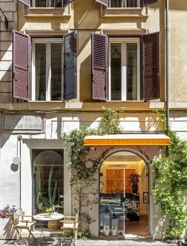 Exterior entrance of Nerva Boutique Hotel, a family-run stay beside the ancient Forum of Nerva