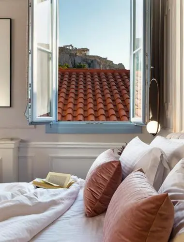 Acropolis view from a restored townhouse suite at A77 Suites, a boutique hotel in Athens