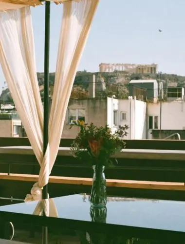 Acropolis views from the rooftop terrace at MONA, one of the most stylish hotels with Acropolis views in Athens