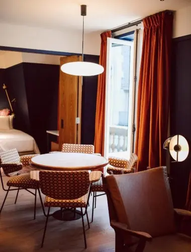 Hôtel Le Ballu guest room with balcony and residential-style interiors in Pigalle Paris