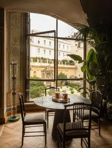 Private dining area overlooking a historic Roman courtyard at Palazzo Shedir