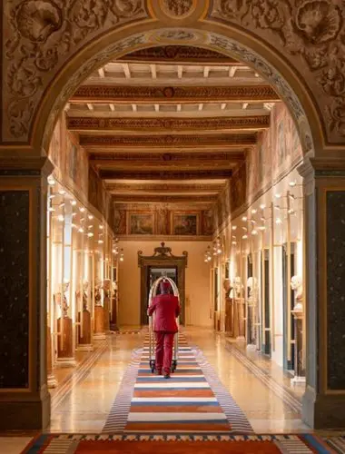 Grand corridor with vaulted ceilings and theatrical design at Palazzo Talìa